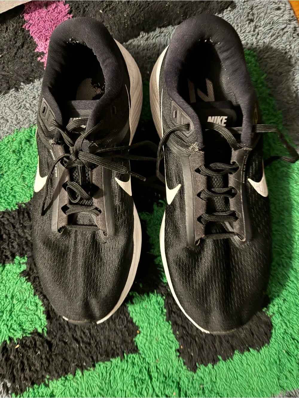 Nike Black Athletic Running Shoes with White Swoosh